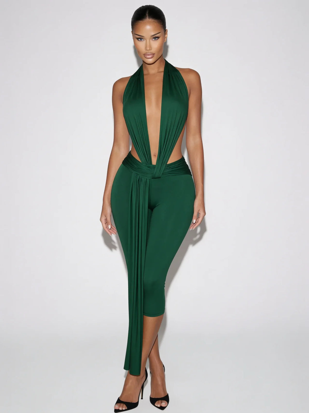 Samira emerald green plunge halter jumpsuit with open sides and draped waist