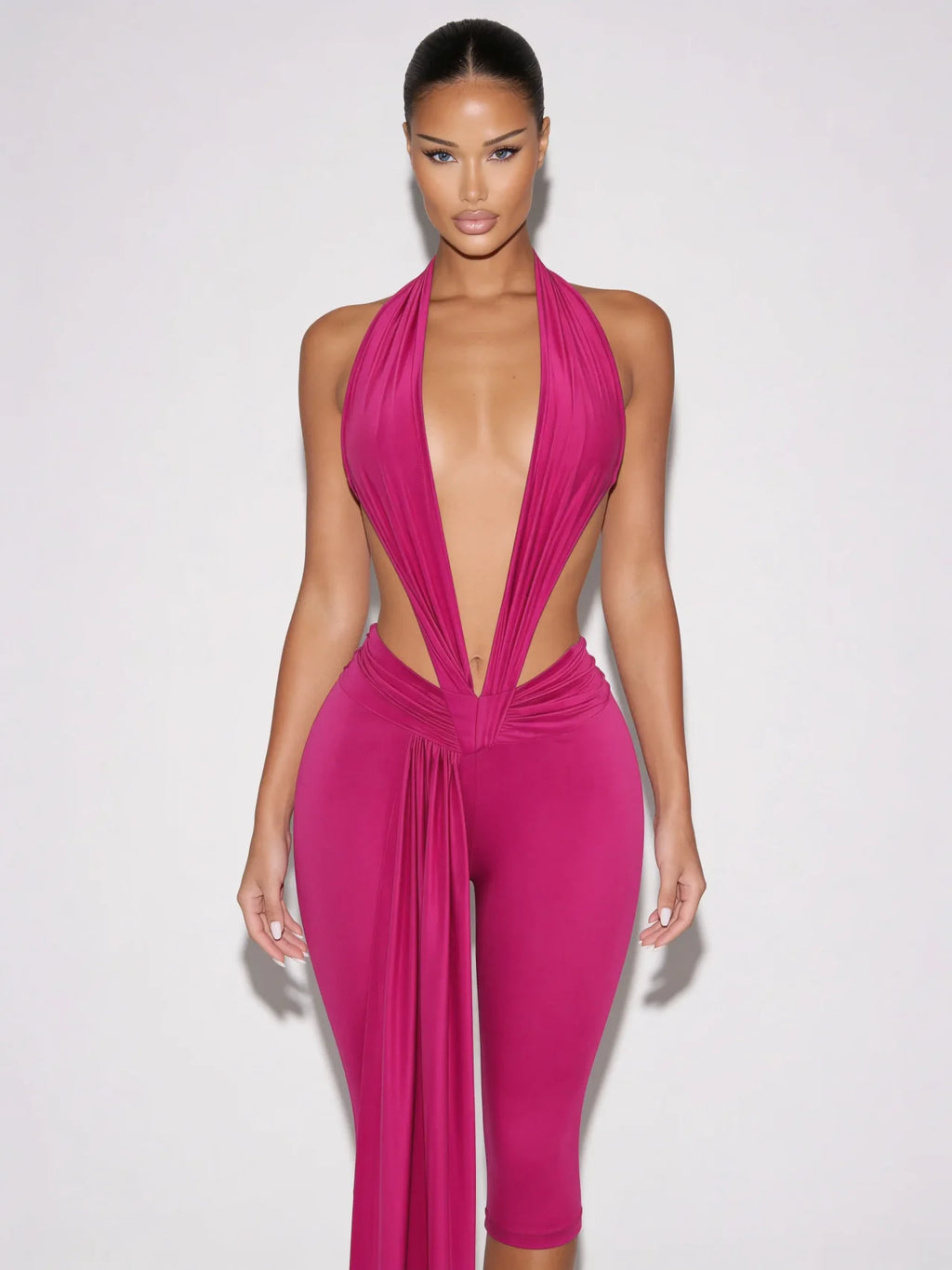 Samira fuchsia pink plunge halter jumpsuit with open sides and draped waist