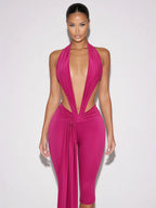 Samira fuchsia pink plunge halter jumpsuit with open sides and draped waist